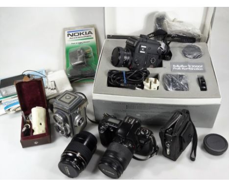 Various cameras and associated equipment, a Rolleiflex SL2000F set, boxed, with hand held camera, 10cm H, Ernst Leitz boxed f