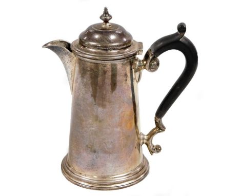 An Edwardian silver coffee pot, Queen Anne style, of small proportion with domed lid, urn finial, ebonised ear scroll handle,