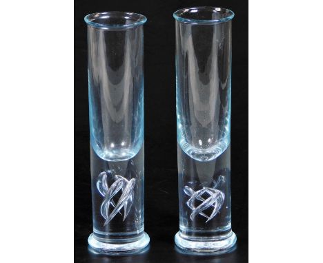 Two Holmegaard Highlife Per Lutken glasses, in clear glass with swirl design to the lower sections, 22.5cm H.