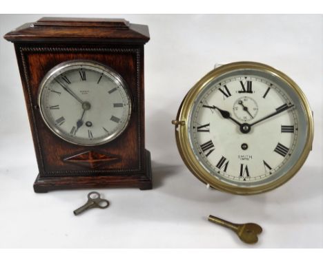 A 1920's oak mantel clock, in rectangular case with a bead outline, with 11cm Dia. steel dial with Roman numerals, keywind an