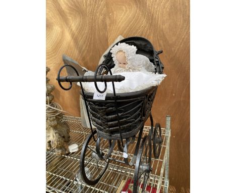 A VINTAGE WOODEN DOLLS PRAM AND DOLL 