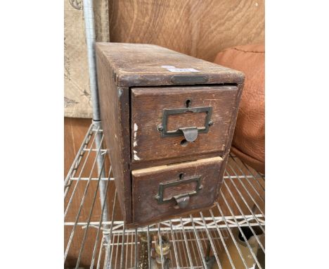 A VINTAGE WOODEN 'MANIFOLDIA' TWO DRAWER INDEX CABINET CONTAING HARDWARE AND ELECTRICAL TAPE 