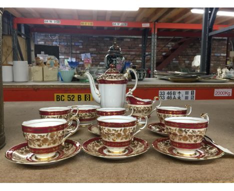 A PARAGON CHINA COFFEE SET IN A CRIMSON AND GILT PATTERN TO INCLUDE A COFFEE POT, CREAM JUG, SUGAR BOWL, SIX CUPS AND SAUCERS