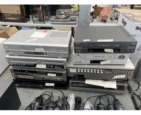 AN ASSORTMENT OF ITEMS TO INCLUDE A PROLINE VHS/DVD PLAYER, A BUSH DVD RECORDER AND FURTHER VHS PLAYERS ETC 
