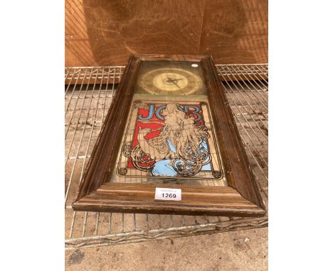 A VINTAGE WALL CLOCK WITH DECORATIVE MIRRORED DETAIL 