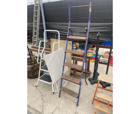 A FIVE RUNG TUBULAR METAL STEP LADDER, A THREE STEP LADDER AND A FOLDING TABLE 