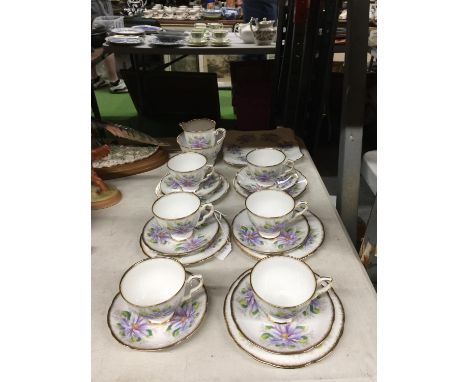 A ROYAL STAFFORD 'DAHLIA' TEASET TO INCLUDE CAKE PLATE, CREAM JUG, SUGAR BOWL, CUPS, SAUCERS AND SIDE PLATES 