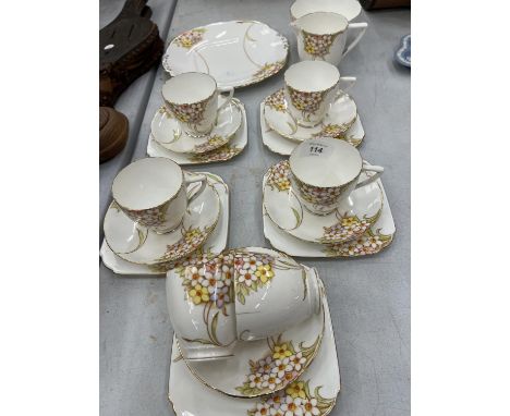 A QUANTITY OF T &amp; K LONGTON, KENT CHINA TEAWARE TO INCLUDE TRIOS, CREAM JUG, SUGAR BOWL AND SANDWICH PLATE, ALL WITH A PR