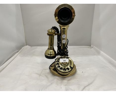 A VINTAGE STYLE BRASS COLOURED CANDLESTICK TELEPHONE 