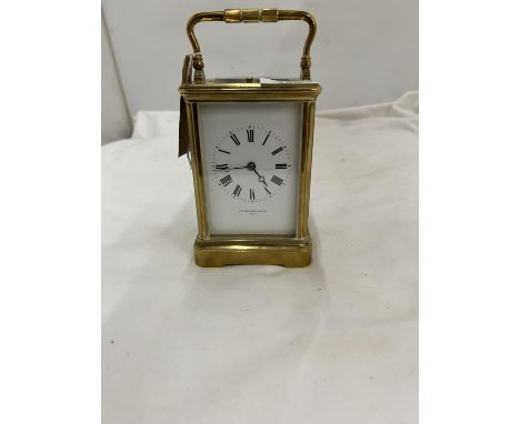 A BRASS JOSEPH PENLINGTON, PARIS, CARRIAGE CLOCK WITH GLASS TO THREE SIDES AND TOP IN WORKING ORDER AT TIME OF CATALOGUING 