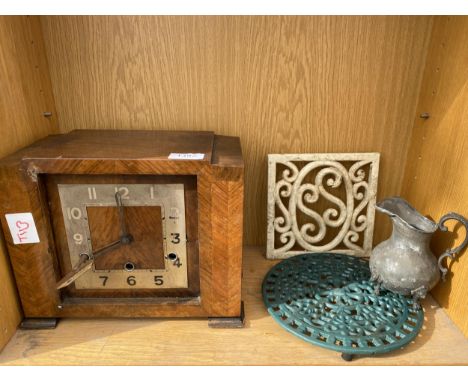 A WOODEN MANTLE CLOCK, TWO TRIVET STANDS AND A JUG 