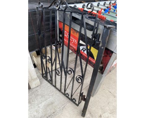 A DECORATIVE WROUGHT IRON GARDEN GATE AND GATE POST 
