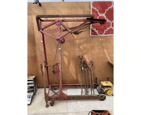 A LARGE VINTAGE CAST IRON ENGINE LIFT BEARING THE LABEL STEVCO 