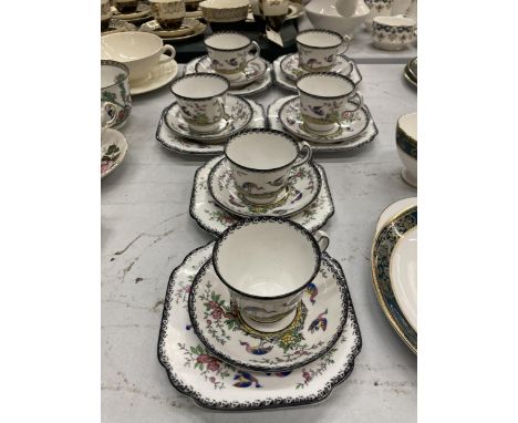 A MELBAROSE MELBA CHINA 18 PIECE HAND PAINTED TEASET WHITE WITH BLACK TRIM FEATURING BIRDS OF PARADISE 