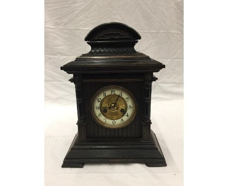 AN ORNATE CHIMING MANTLE CLOCK WITH GERMAN MOVEMENT AND PENDULUM. KEY IS PRESENT AND WORKING AT TIME OF CATALOGING. 