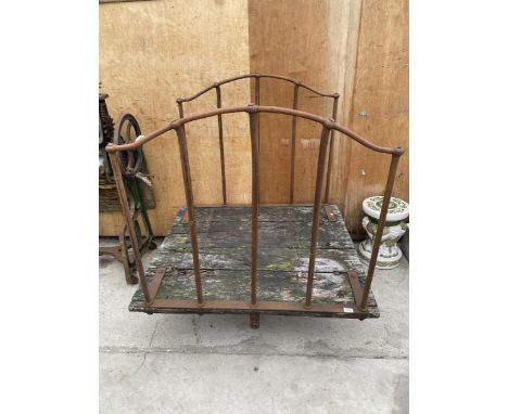 A VINTAGE CAST IRON AND WOODEN PLANKED FOUR WHEELED TROLLEY (ONE WHEEL MISSING) 