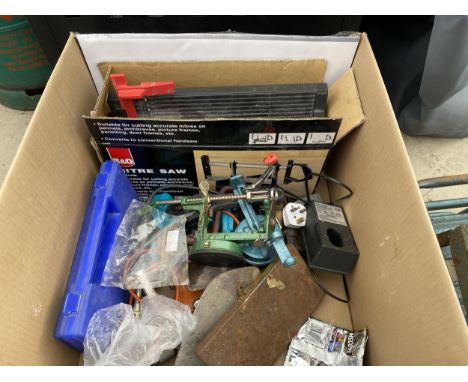 AN ASSORTMENT OF TOOLS TO INCLUDE A DRILL, A MITRE SAW AND TROWELS ETC 