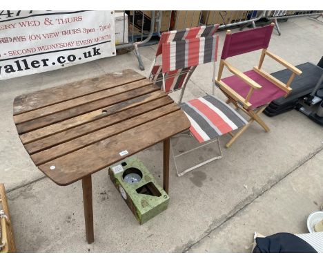 A WOODEN GARDEN TABLE TO METAL FOLDING CHAIRS, A DIRECTORS CHAIR AND AN OUTSIDE CLOCK 