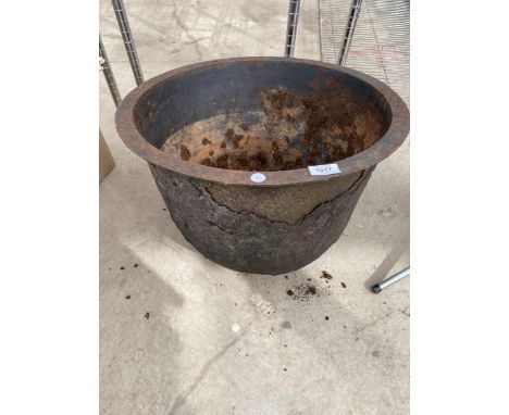 A ROUND VINTAGE CAST IRON PLANTER 