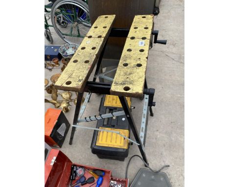 A FOLDING WORK MATE BENCH AND A PLASTIC TOOL BOX CONTAINING SPANNERS AND SCREW DRIVERS 