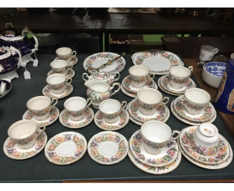 A LARGE QUANTITY OF PARAGON 'COUNTRY LANE' TEAWARE TO INCLUDE CUPS, SAUCERS, CAKE PLATE, CAKE STAND, CREAM JUG AND SUGAR BOWL