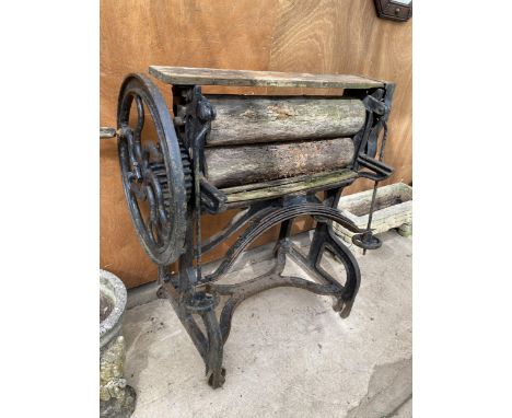 A VINTAGE CAST IRON AND WOODEN MANGLE 
