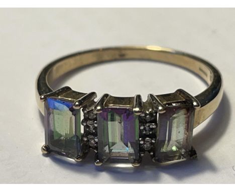 A 9 CARAT GOLD RING WITH THREE MYSTIC TOPAZ AND DIAMONDS SIZE Q/R 