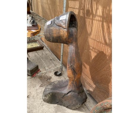 A VINTAGE TREE ABSTRACT CARVING OF A FIGURE 