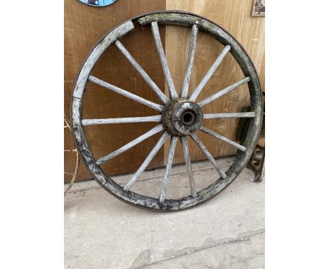 A VINTAGE WOODEN CART WHEEL WITH CAST IRON BANDING (D:170CM) 