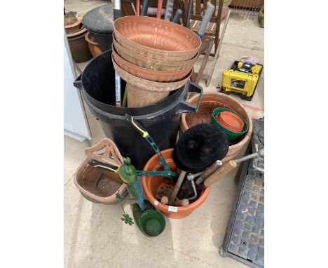 AN ASSORTMENT OF TOOLS TO INCLUDE SHEARS, AN AXE AND PLANT POTS ETC 