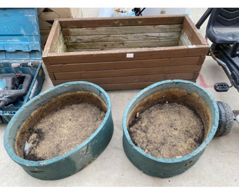 A WOODEN TROUGH PLANTER AND A PAIR OF RECONSTITUTED STONE PLANTERS 