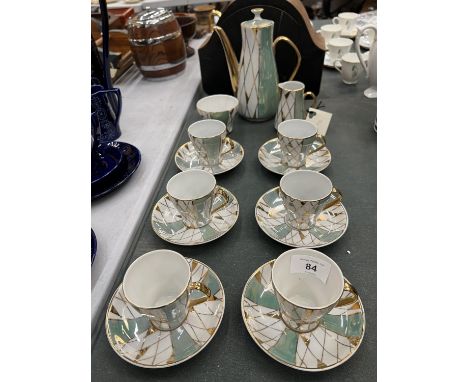 A LUSTRE COFFEE SET IN A HARLEQUIN PATTERN TO INCLUDE COFFEE POT, CREAM JUG, SUGAR BOWL, CUPS AND SAUCERS 