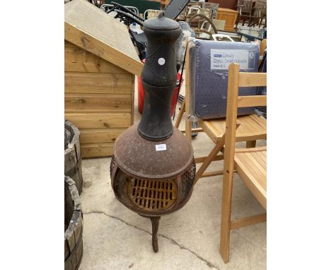 A VINTAGE CAST IRON GARDEN CHIMENEA 