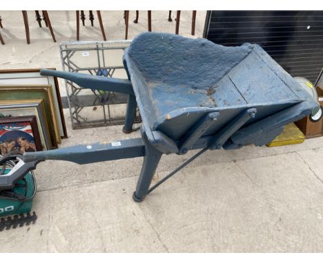 A HEAVY VINTAGE WOODEN WHEEL BARROW PLANTER 
