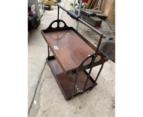 A VINTAGE WOODEN TWO TIER FOLDING TRAY 