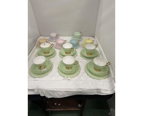 A SET OF SIX 'PARAGON' SMALL CUPS AND SAUCERS IN DIFFERENT COLOURS PLUS A SET OF SIX ROSLYN CHINA TRIOS IN A PALE GREEN COLOU