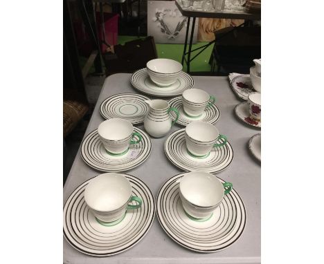 A WEDGWOOD BONE CHINA TEASET IN A SILVER AND GREEN COLOURED CIRCULAR DESIGN TO INCLUDE CAKE PLATES SUGAR BOWL, CREAM JUG, FIV