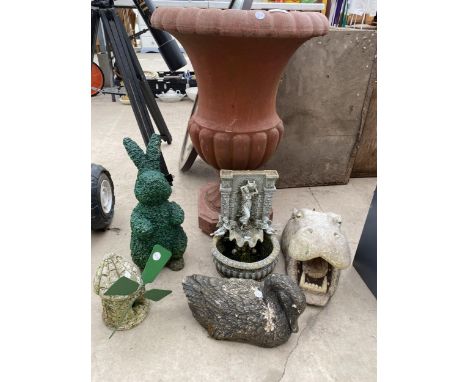 AN ASSORTMENT OF GARDEN ITEMS TO INCLUDE A PLASTIC URN PLANTER, A RECONSTITUTED STONE DUCK, A WATER FEATURE, AND A PLASTIC FL