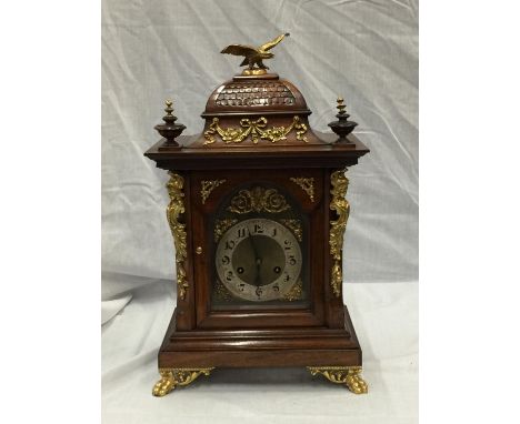 A 19TH CENTURY MAHOGANY CASED BRACKET CLOCK WITH FULL BRASS DIAL AND SILVER CHAPTER RING ORMOLA DECORATIONS SURMOUNTED WITH E