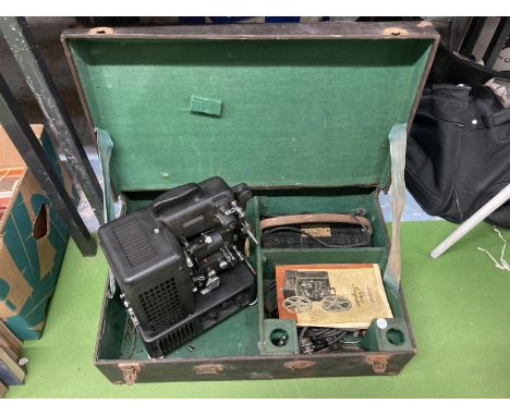 A VINTAGE DITMAR FILM PROJECTOR IN A CASE WITH INSTRUCTIONS AND ANCILLARIES 