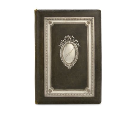 A silver-mounted leather folioFabergé, Moscow, 1908-1917rectangular, with neo-classical borders, centred with oval reserve en