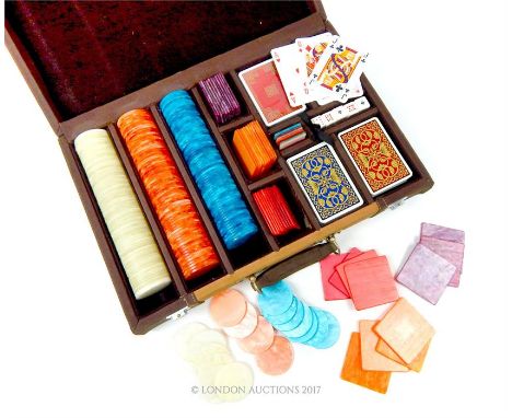 A Harrods, cased and complete, poker set with playing cards, chips and dice in a suitcase-style box bearing a gilded 'H' and 
