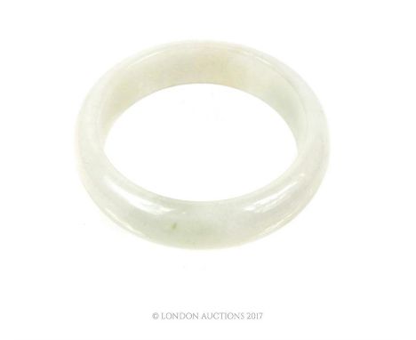 A Chinese white jade bangle;7.5 cm diameter 