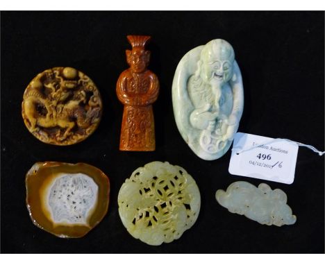 A collection of six jade and agate items, including carved Chinese pendants.