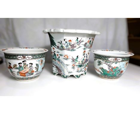A Chinese octagonal planter with polychrome decoration of garden scenes, height 23cm and a pair of similar Chinese planters (
