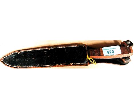 A 20th century double sided stainless steel trench knife, stamped case, wooden handle with leather scabbard, length 26cm. 