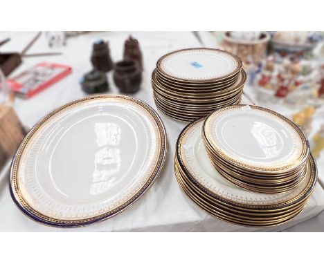A very large selection of Royal Doulton England Higgins and Seiter blue and gilt dinner, dessert and side plates plus meat pl