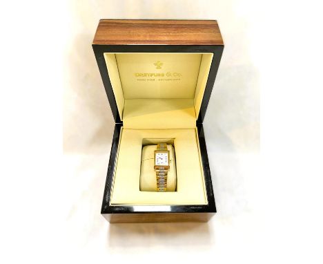 A Dreyfuss &amp; Co. gold plated and stainless steel ladies watch in original box. 