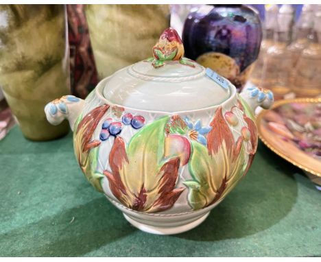 A Clarice Cliff covered vase of squat tapering form, with 2 handles, decorated in polychrome and relief with leaves and berri
