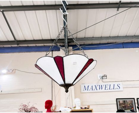 A tiffany style glass ceiling hanging light. 
